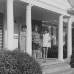 Nancy and Dorothy pose with an unidentified friend on the porch of Nancy’s childhood home.