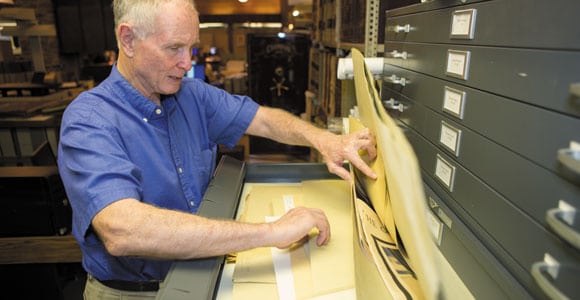 Paul Clements examines documents at the Metropolitan Government Archives in Nashville. His expansive “Chronicles of the Cumberland Settlements” compiles first-person accounts on the settlement of Middle Tennessee.