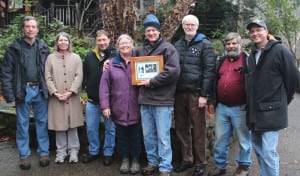 Members of the Tennessee Chapter of the American Chestnut Foundation (TACF) present Dr. Gregory Weaver with the National American Chestnut Foundation Volunteer Service Award for his efforts with the organization. From left are Clint Neel, Vicki Turner, Sean Fisher, Paula Phelps-Weaver, Dr. Weaver, Tennessee Chapter TACF President Joe Schibig, Jack Torkelson and Tim Phelps.