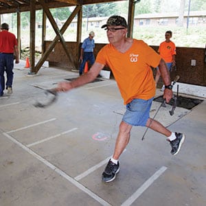 Doug Farnsworth practices at the Bob Hassan Horseshoe Pavillion in Crossville’s Centennial Park. The Crossville Horseshoe Club hosts leagues on Tuesdays and Thursdays.