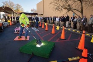 Attendees watch a high-voltage safety demonstration.