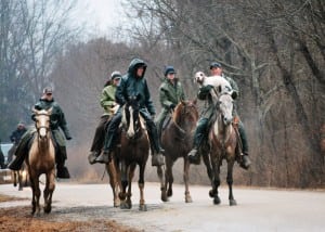 Caladen’s Rail Hawk gets a lift to the stables in a steady rain following an afternoon brace in 2014.