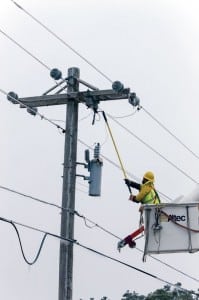 A co-op lineman fuses a line following a series of destructive winter storms. Linemen faced brutally cold weather during the restoration efforts.