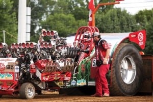 Bret Berg backs into position to hook to the sled in LG Seeds Moneymaker in the Modified Division. The tractors sport Allison Aircraft or Jet turbine engines.