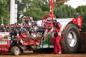 Bret Berg backs into position to hook to the sled in LG Seeds Moneymaker in the Modified Division. The tractors sport Allison Aircraft or Jet turbine engines.