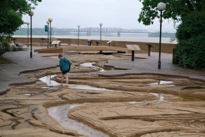 A visitor wades through Mud Island’s re-creation of the river’s route.