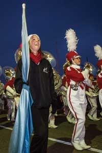 Months of diligent practice create the precision it takes for a group of 230 high school students to march and perform in unity, but as one can see, they have a lot of fun doing it. 