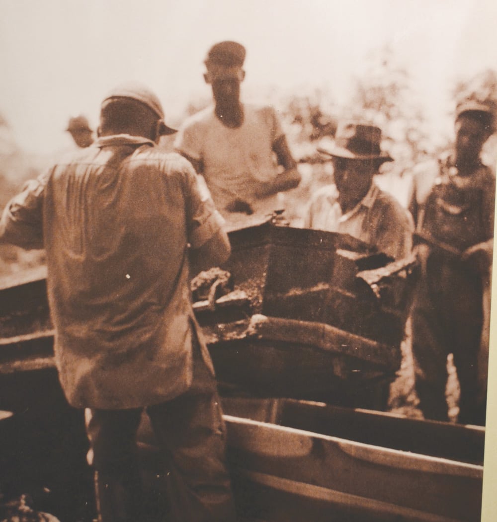 A group of men remove a coffin from a grave in preparation of the manmade lake that covered the former community of Butler. (Butler Museum photo)