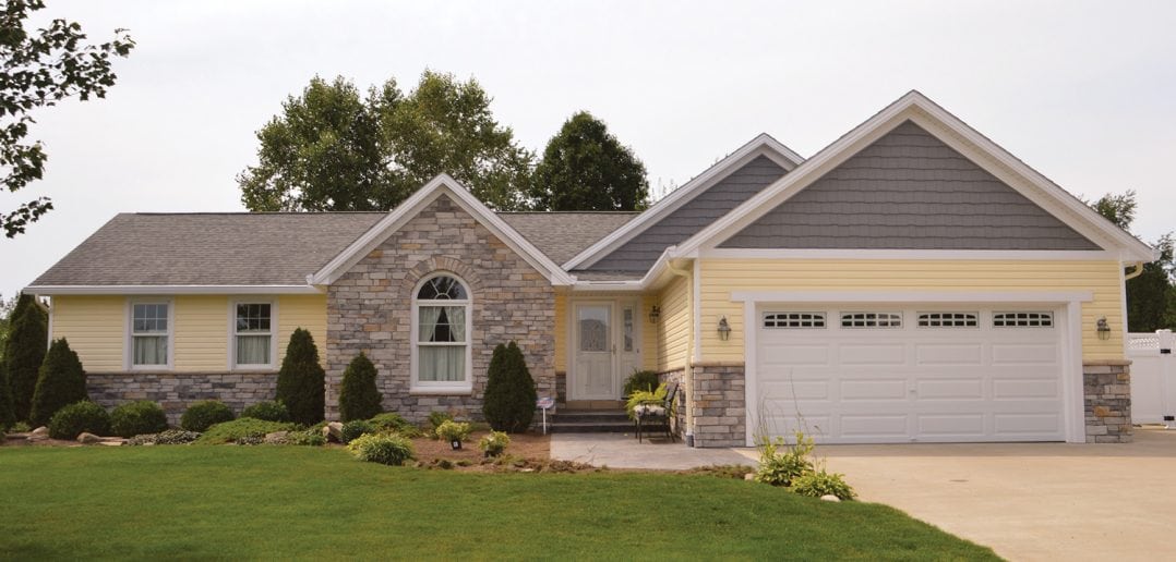 Miller Custom Exteriors enhanced the look of this ranch-style home with the addition of seamless steel siding. (Photo courtesy of Miller Custom Exteriors)