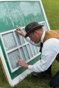 Even the scorekeeping is done old school as Trapper "Mamas Boy" Haskins fills in the scoreboard.
