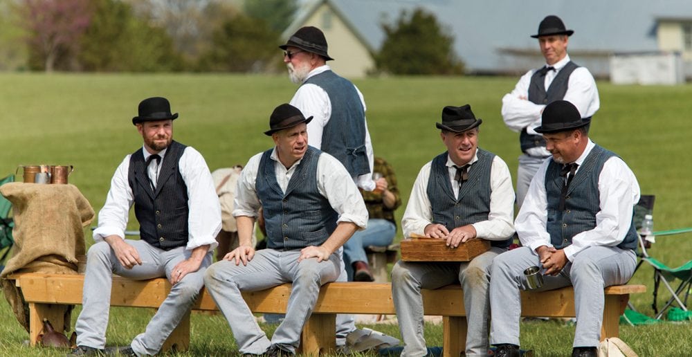 Jeff “Skeeter” Wells, seated left, discusses a play with his Stewart’s Creek teammates. Wells is the team’s co-captain.