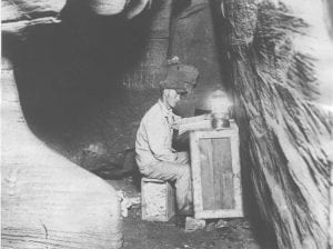 James Lewis in the chart room in Nickajack Cave where Lawrence S. Ashley had studied and charted the cave before beginning his exploration. Ashley became lost in the cave in 1927. Courtesy of the Tennessee State Library and Archives