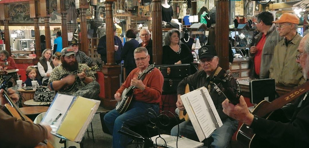 Members of the Jackson Area Plectral Society play Oldtime music in the ice cream parlor at Casey Jones Village. Photo by Doyle Freeman, courtesy of the Jackson Area Plectral Society