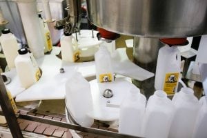 A bottling machine prepares milk for delivery.