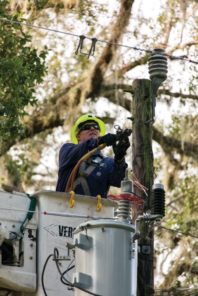 DREMC’s Heath Nave helps restore power in Palatka, Florida.