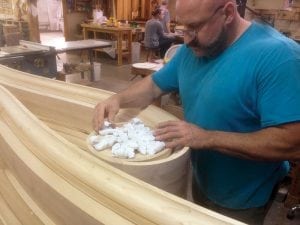 Craftsman Trent Buhr begins assembly of the many decorative pieces that'll give this organ its individuality.